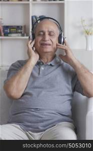 Old man listening to music