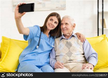 old man nurse taking selfie