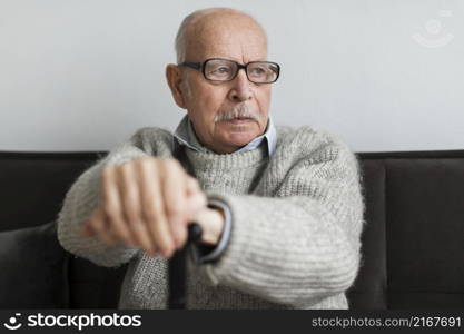 old man nursing home with glasses cane