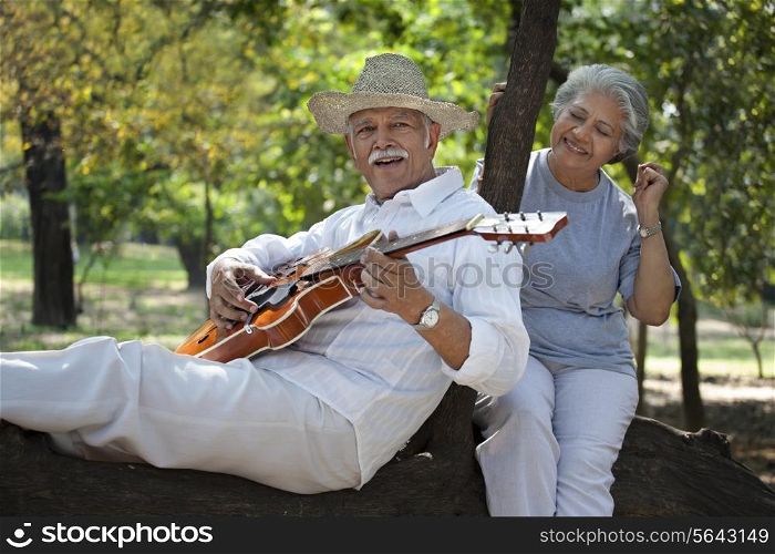 Old man playing the guitar