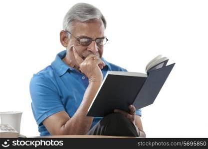 Old man reading a book