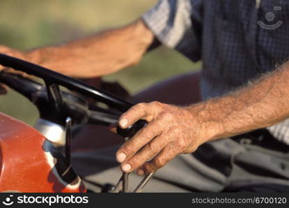 Old Man Riding Lawnmower