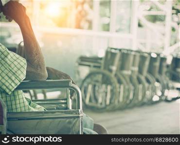 Old man sit on wheelchair,Vintage Style.