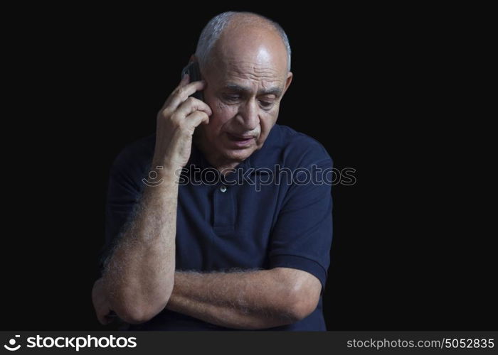 Old man talking on mobile phone