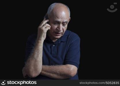 Old man talking on mobile phone