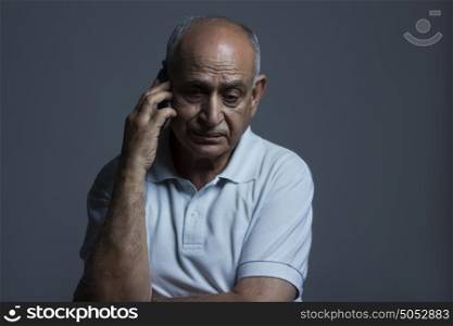 Old man talking on mobile phone