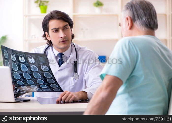 Old man visiting young male doctor 