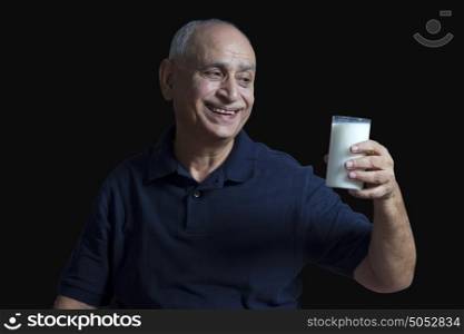 Old man with glass of milk