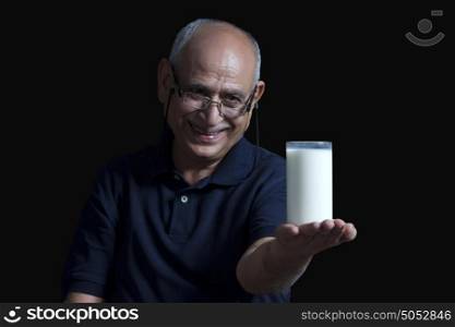 Old man with glass of milk