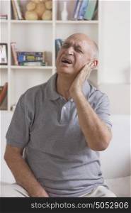 Old man with pain in ear