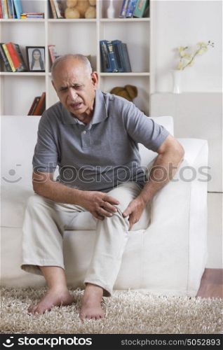 Old man with pain in knee