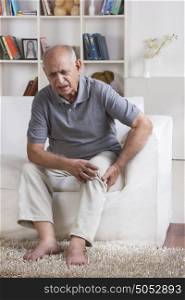 Old man with pain in knee