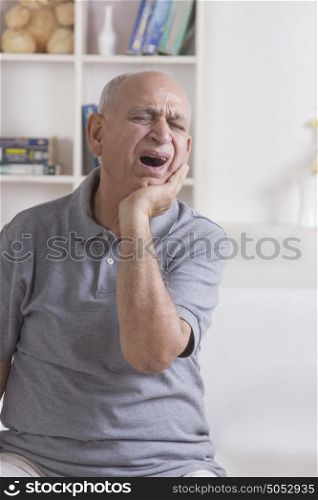 Old man with tooth ache