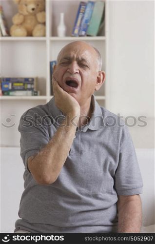 Old man with toothache