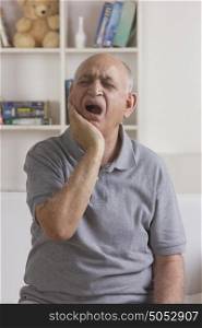 Old man with toothache