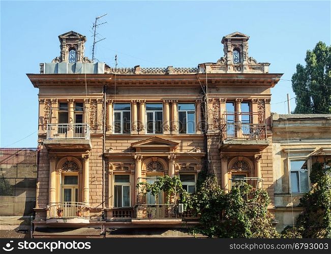 Old mansion, decorated with columns and bas-reliefs. Odessa, Ukraine.
