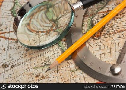 old map and a loop with a protractor, still life