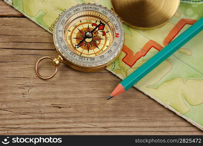 old map and compass on a wooden table