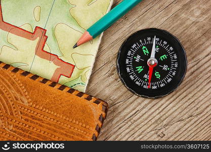 old map and compass on a wooden table