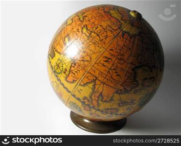 Old map ball of the world on a white background