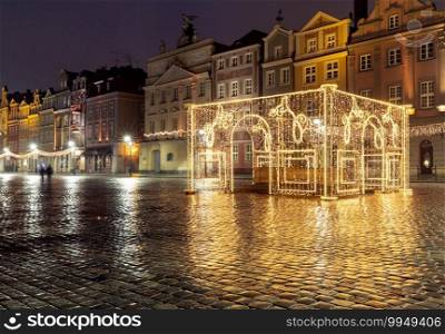 Old market square and colorful facades of medieval houses at night. Poznan. Poland.. Poznan. Old town square at night.