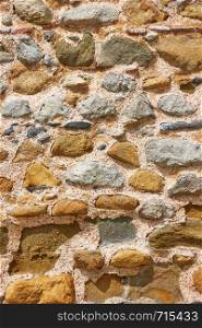 Old masonry of rough stones, may be used as background