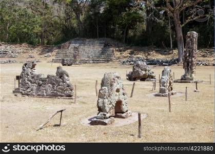 Old mayabn statues on the square in Copan, Honduras
