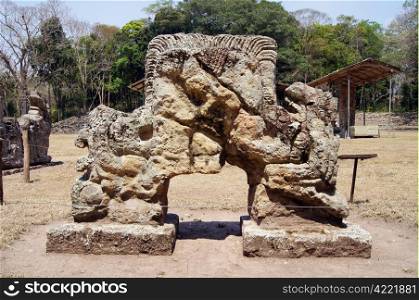 Old mayan statue on the square in Copan, Honduras