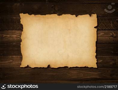 Old mediaeval paper sheet. Horizontal parchment scroll on a wood board background. Old mediaeval paper sheet. Horizontal parchment scroll on a wood board