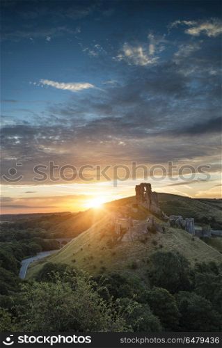 Old medieval castle ruins in vibrant Summer sunrise landscape im. Landscapes. Old medieval castle ruins in Summer sunrise landscape image