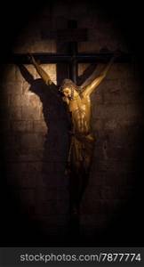 Old medieval crucifix in Italian church - made of wood