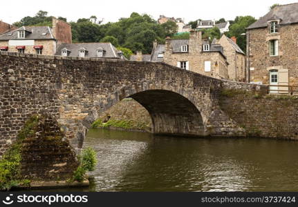 Old medieval stone bridge in Dinan, France