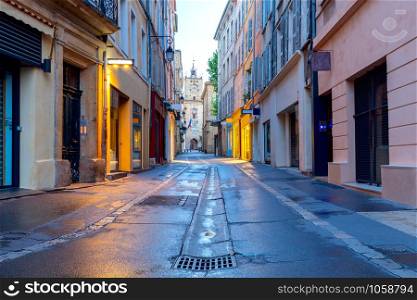 Old medieval street in night lighting at sunrise. France. Prvance. Aix-en-Provence.. Aix-en-Provence. Old narrow street in the historic center of the city.
