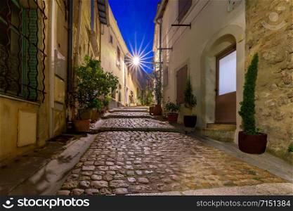 Old medieval street in the early morning. France. Arles. Provence. Arles. Old narrow street in the historic center of the city.