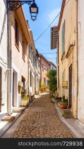 Old medieval street in the early morning. France. Arles. Provence. Arles. Old narrow street in the historic center of the city.