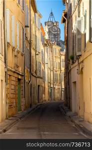 Old medieval street with multi-colored house facades. France. Provence. Avignon. Avignon. Old narrow street in the historic center of the city.