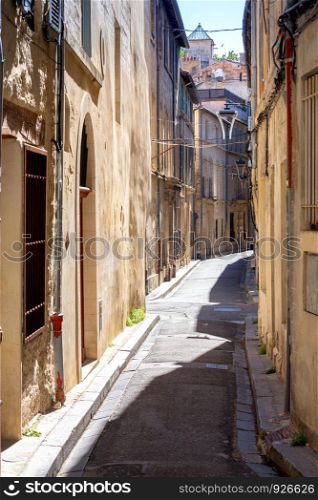 Old medieval street with multi-colored house facades. France. Provence. Avignon. Avignon. Old narrow street in the historic center of the city.