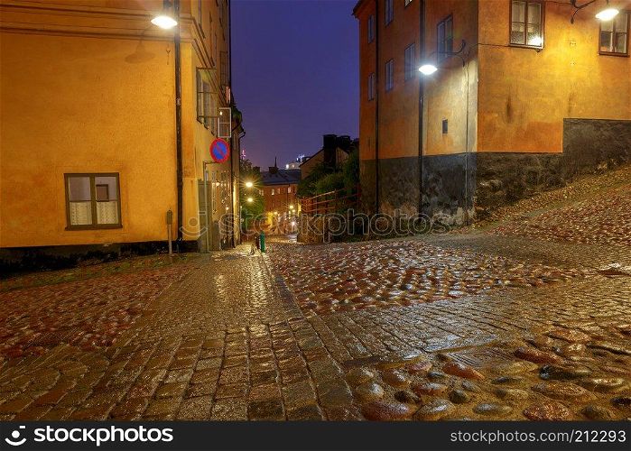 Old medieval traditional street in the night illumination. Stockholm. Sweden.. Stockholm. Old street at night.