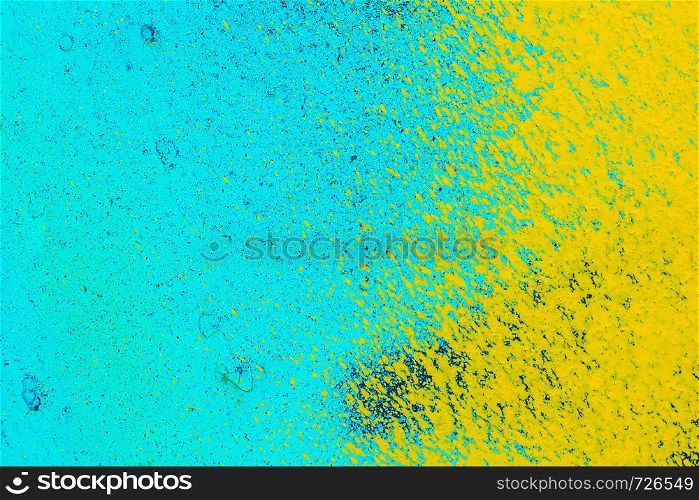 old metal blue surface with yellow paint. Abstract background, texture