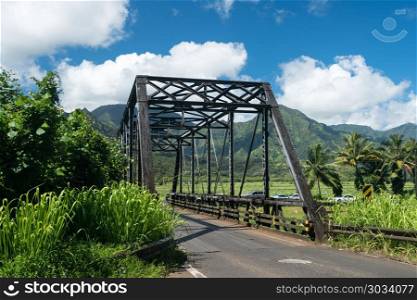 Old metal girder bridge on road to Hanalei Kauai. Old metal girder and wood bridge on the road to Hanalei from Princeville in Kauai, Hawaii. Old metal girder bridge on road to Hanalei Kauai