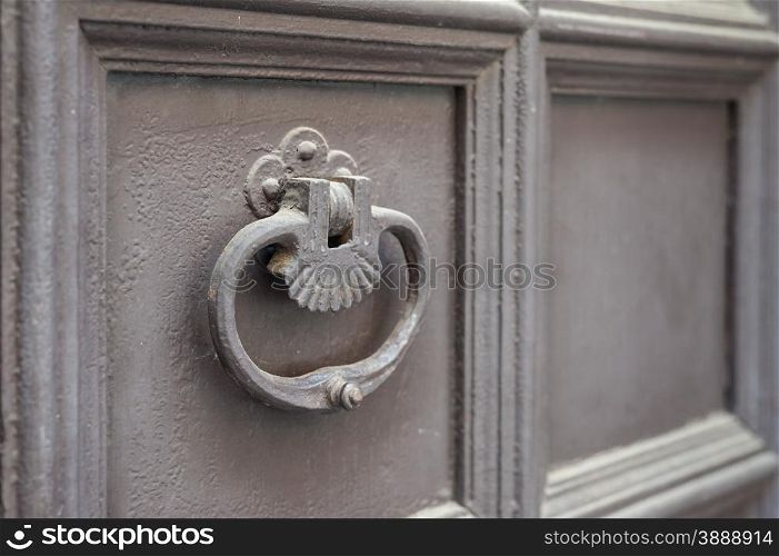 Old metal knocker on a door