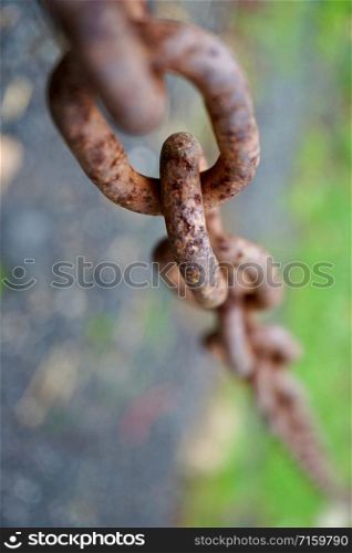 old metallic brown chain abandoned on the street