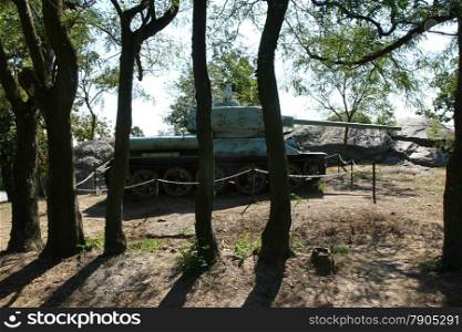 Old military tank as a relic of World War II in the forest near Vrsac in Serbia
