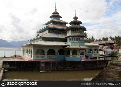 Old mosque on the lake Maninjau in Indonesia