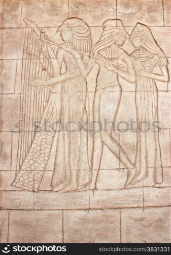 Old murals. Frieze of Egyptian Goddess. Wall carving.