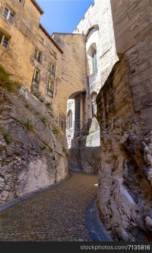 Old narrow medieval street in the historical part of the city. Avignon. Provence.. Avignon. Old narrow street in the historic center of the city.