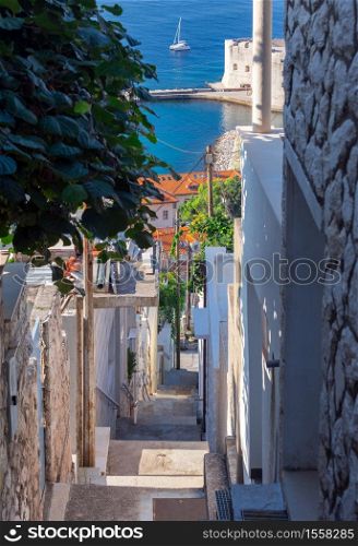 Old narrow medieval street in the historical part of the city. Dubrovnik. Croatia.. Dubrovnik. Old narrow traditional city street.