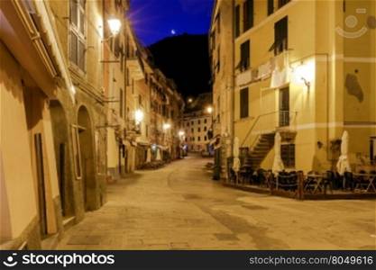 Old, narrow, medieval streets in the Italian village Vernazza. Cinque Terre National Park, Liguria, Italy.