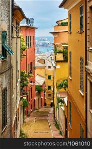 Old narrow street in Genoa city, Italy