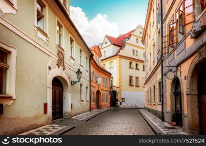 Old narrow street of Prague at dawn